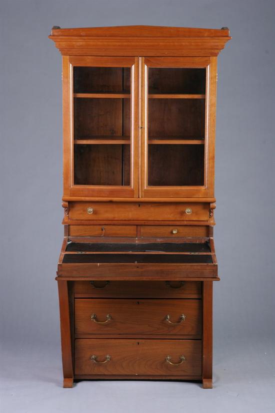 Appraisal: WALNUT FLIP-DOWN SECRETARY BOOKCASE early th century Pediment with ogee