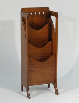 Appraisal: A Finnigans mahogany magazine rack the back panel with pierced