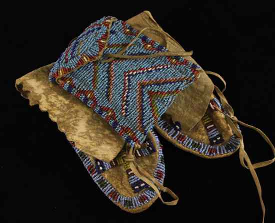 Appraisal: A pair of early th century Native American beadwork moccasins