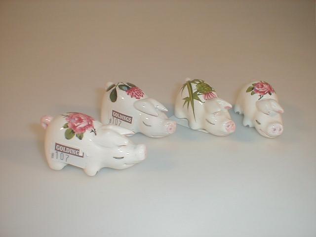 Appraisal: A set of four Plichta Pigs two decorated with pink