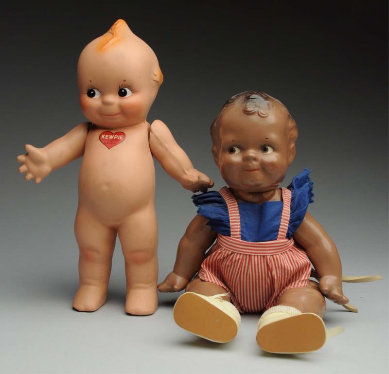 Appraisal: Lot Of Character Dolls Both all composition Kewpie with jointed