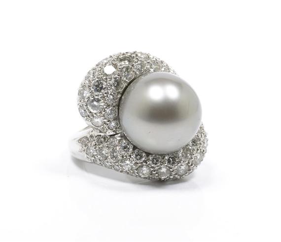 Appraisal: TAHITI PEARL AND DIAMOND RING Platinum g Very decorative cocktail