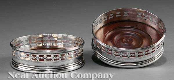 Appraisal: A Pair of George III Crested Sterling Silver Wine Coasters