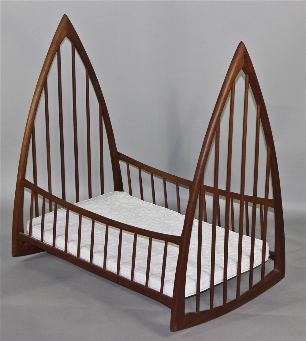 Appraisal: GOTHIC INSPIRED STUDIO WALNUT SPINDLE ROCKING CRADLE G E REDFIELD