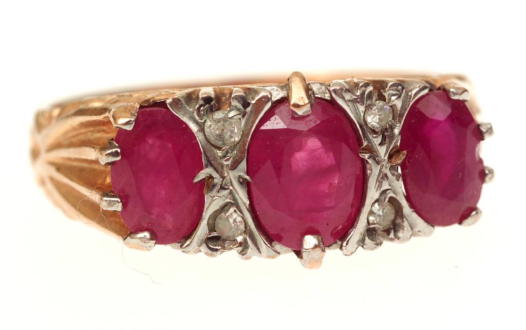 Appraisal: CT GOLD RING SET WITH THREE RUBIES AND FOUR SMALL