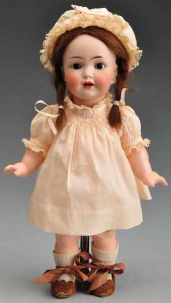 Appraisal: Sweet K R p Character Doll Description German bisque socket