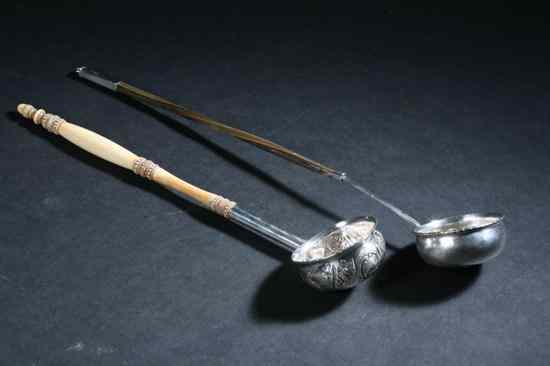 Appraisal: TWO QUEEN ANNE AND GEORGIAN SILVER LADLES Queen Anne ladle