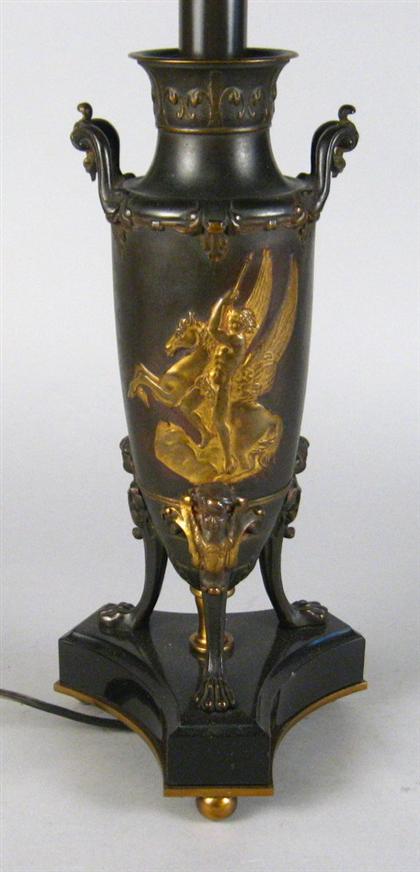 Appraisal: Neoclassical style bronze and gilt bronze urn The side cast