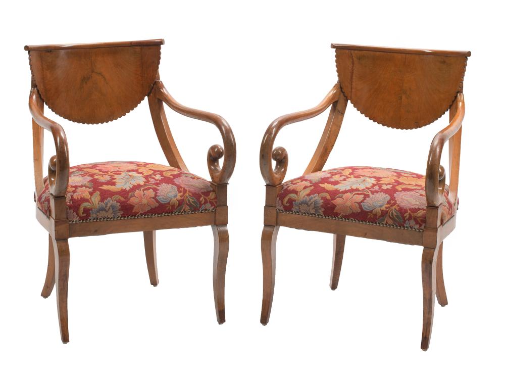 Appraisal: Pair of Biedermeier Carved Fruitwood Armchairs mid- th c incurvate