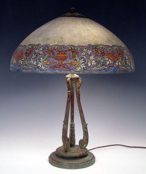 Appraisal: SIGNED HANDEL TABLE LAMP Urn and floral border on chipped