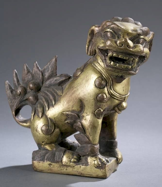 Appraisal: Ching Dynasty Tibetan gold gilt bronze lion A Ching Dynasty