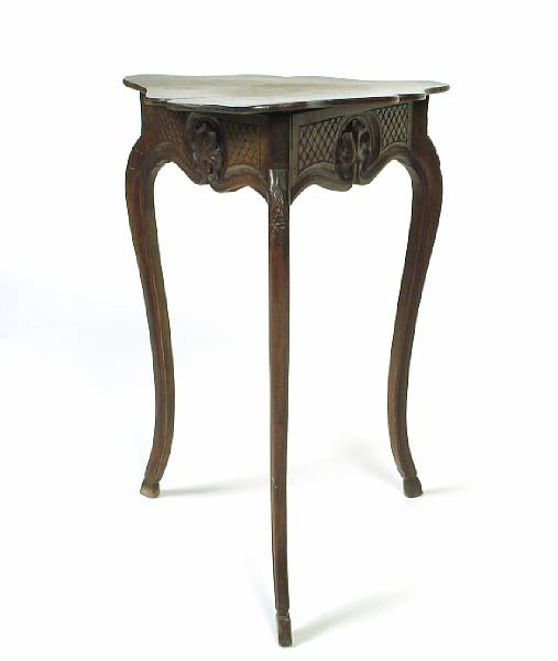 Appraisal: A Continental fruitwood table of triangular form wear and stains