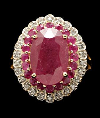 Appraisal: Ruby diamond ring central oval faceted ruby estimated weight cts