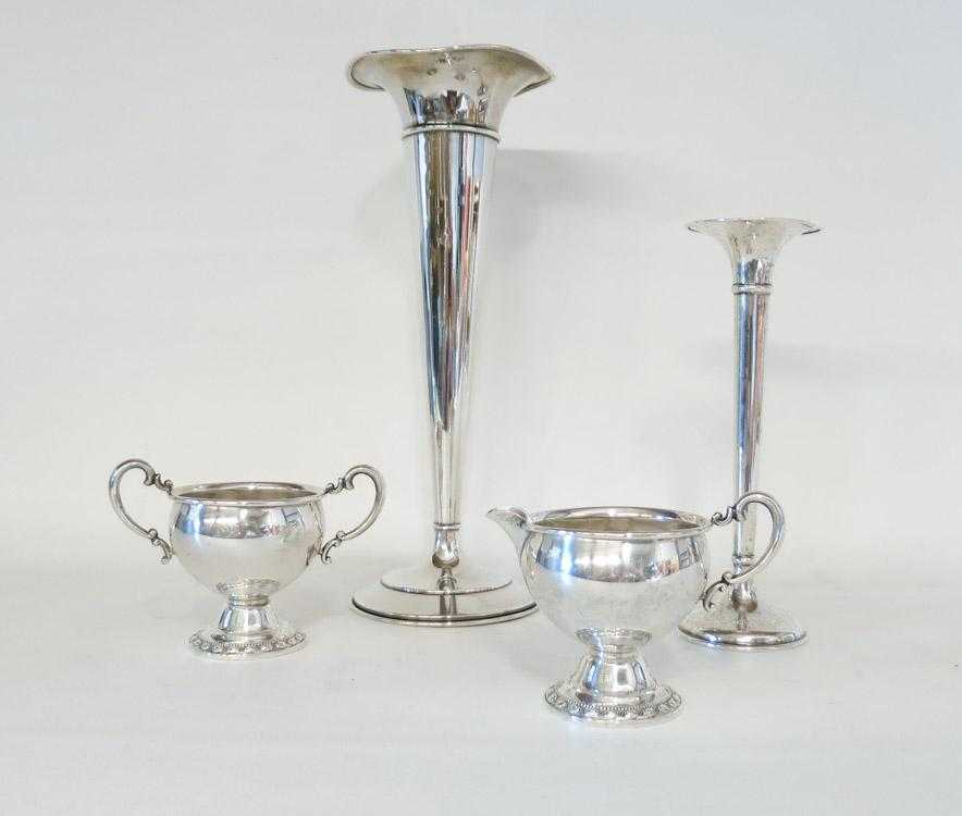 Appraisal: FOUR STERLING SILVER HOLLOWWARE PIECES comprised of trumpet vases and