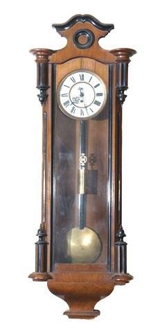 Appraisal: A Continental walnut cased Vienna regulator wall clock having a