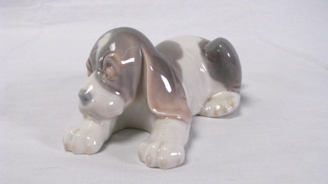 Appraisal: Lladro figurine Beagle Puppy Lying marked Daisa issued retired tall