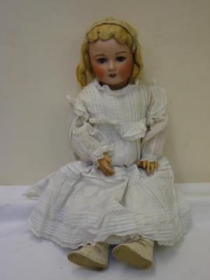 Appraisal: A Bebe Jumeau bisque head doll with blue lashed sleeping