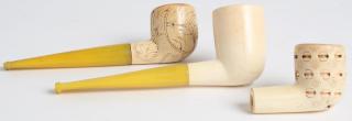 Appraisal: Antique Carved Meerschaum Pipes Two with yellow amber stems Largest