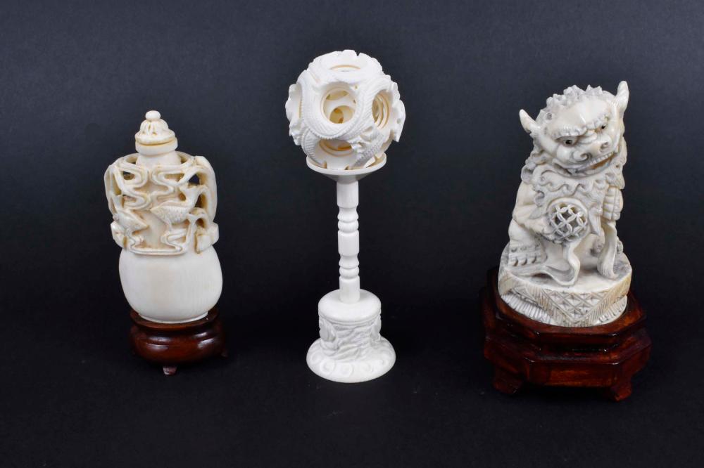 Appraisal: THREE CHINESE CARVED DECORATIVE ITEMSComprising a spherical puzzle ball on