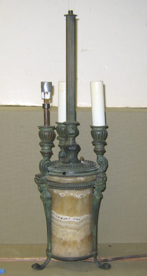 Appraisal: CONTINENTAL MARBLE AND BRONZE TABLE LAMP The cylindrical marble body