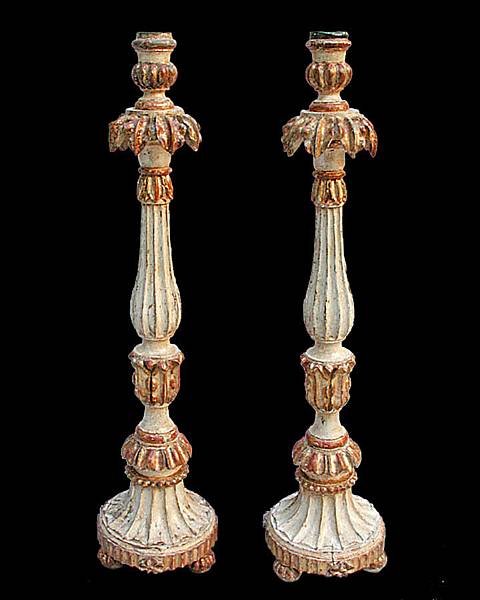 Appraisal: A pair of Portuguese Neoclassical parcel gilt and painted candlesticks