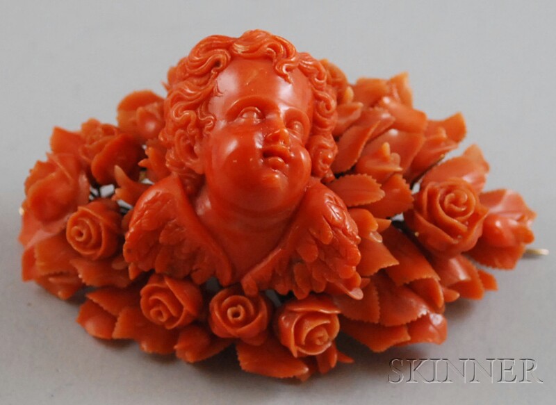 Appraisal: Victorian Carved Coral Brooch the brooch carved in heavy relief