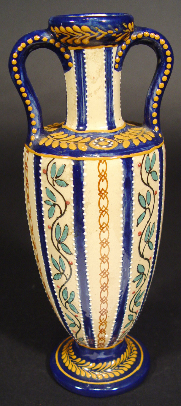 Appraisal: Quimper two handled vase enamelled with leaves and berries onto