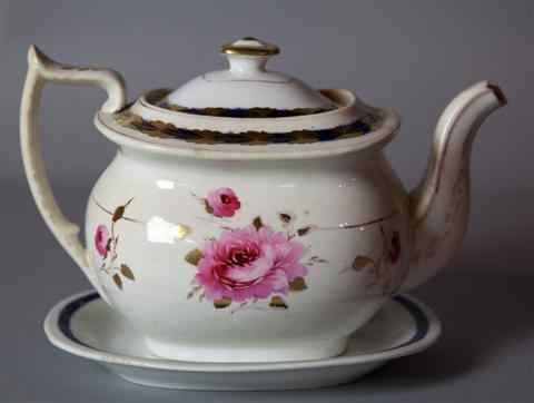 Appraisal: ENGLISH PORCELAIN TEAPOT COVER AND STAND circa with wishbone handle