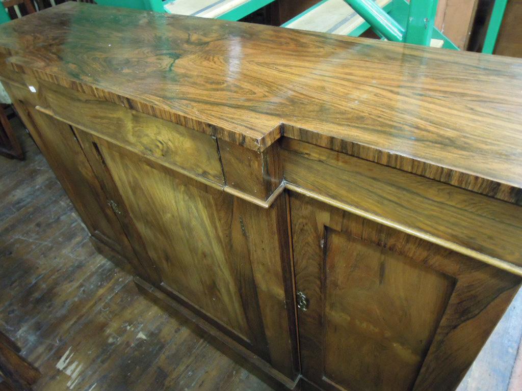 Appraisal: A th century rosewood breakfront side cabinet fitted with a