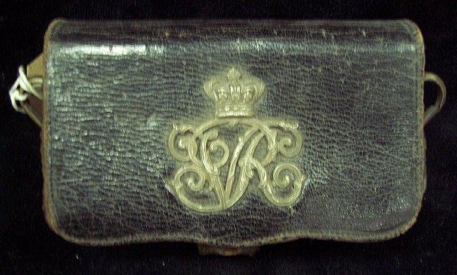 Appraisal: A Victorian sandwich box with silver coloured VR cypher and