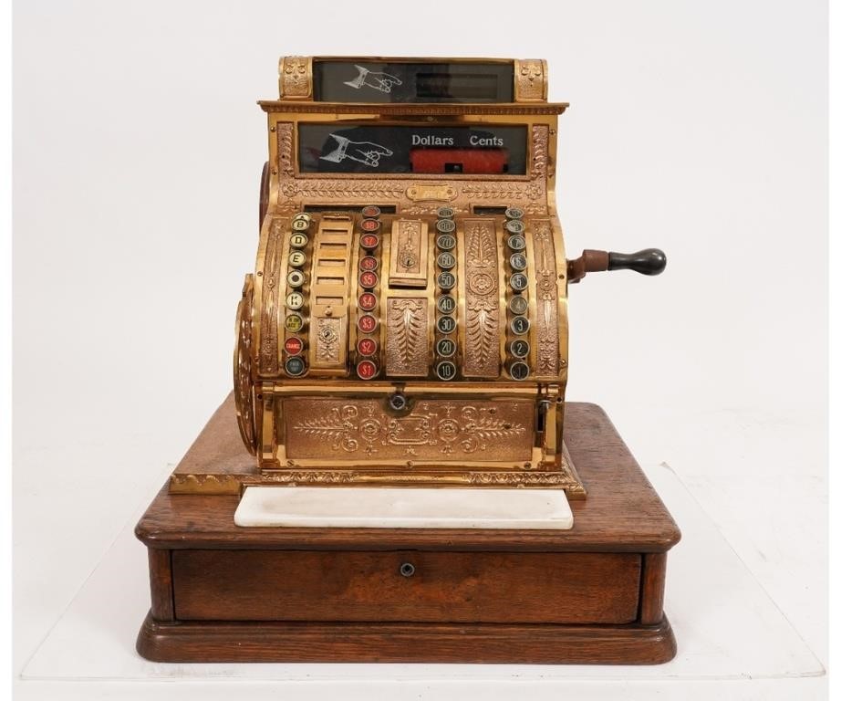 Appraisal: Brass and oak National Cash Register early 's h x