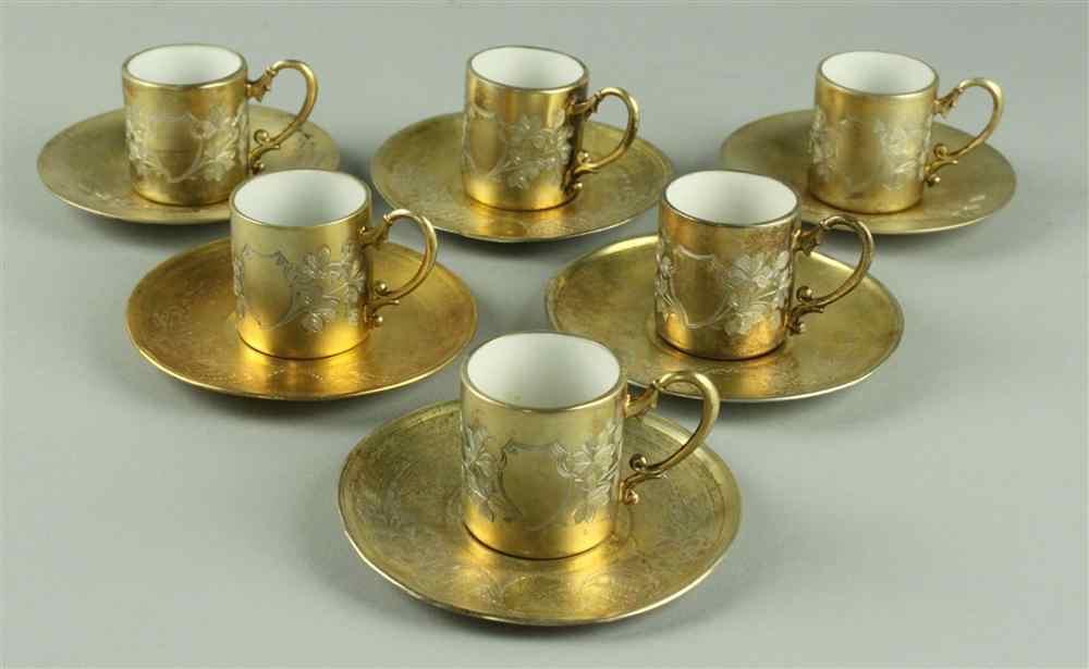 Appraisal: EGYPTIAN ASSEMBLED SILVER GILT AND PORCELAIN DEMITASSE SET saucers date