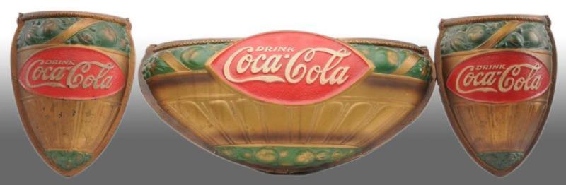 Appraisal: Embossed Fiberboard Coca-Cola Wall Sconce Set Description s Only very