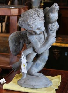 Appraisal: Classical cast stone fountain depicting a putto and dolphin Classical