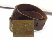 Appraisal: Walt Disney A leather belt with a brass buckle depicting