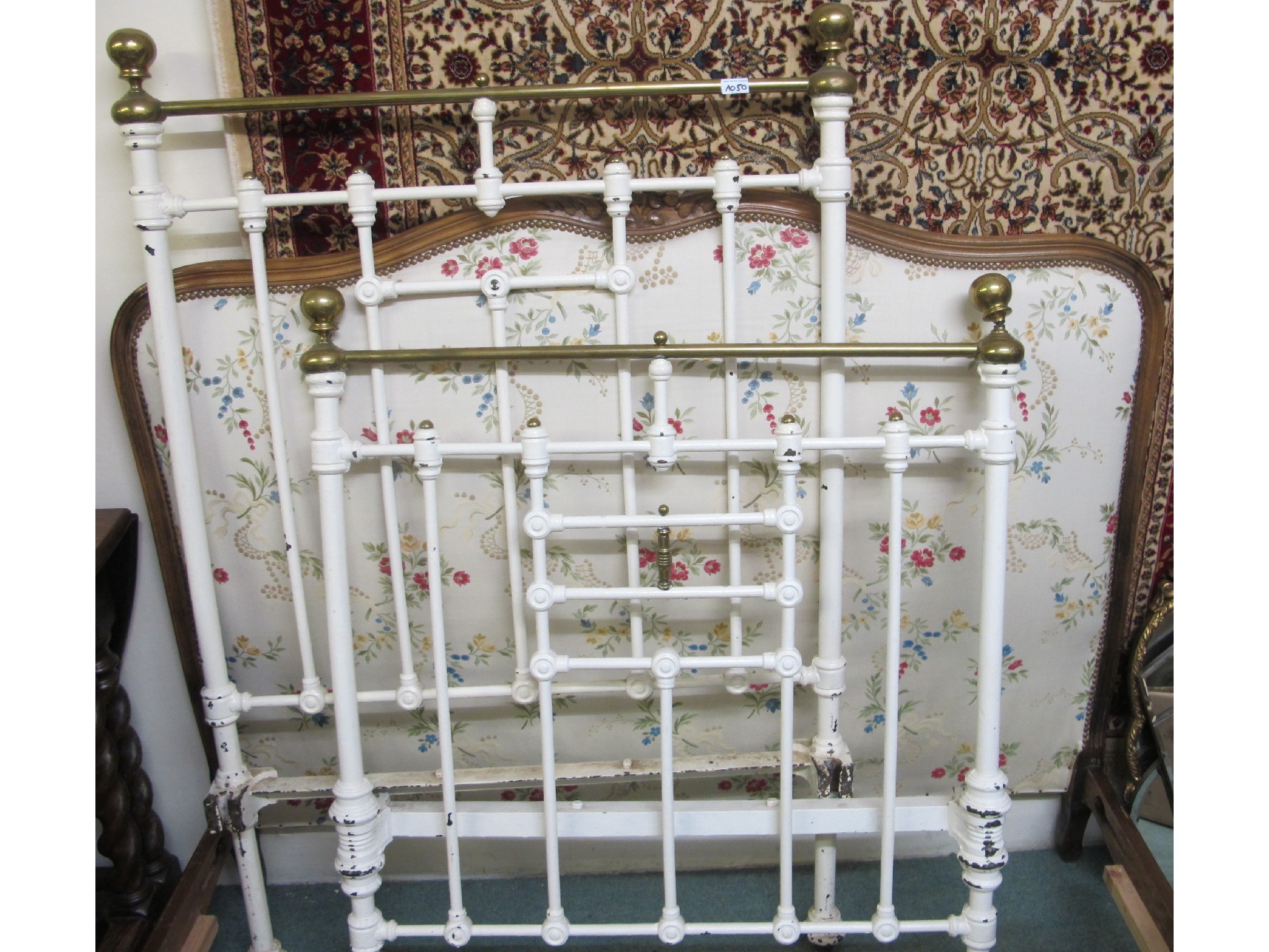 Appraisal: A French beech framed double bed with studded floral fabric