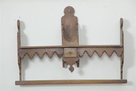 Appraisal: HANGING SHELF Folky spoon rack with carved ends and small