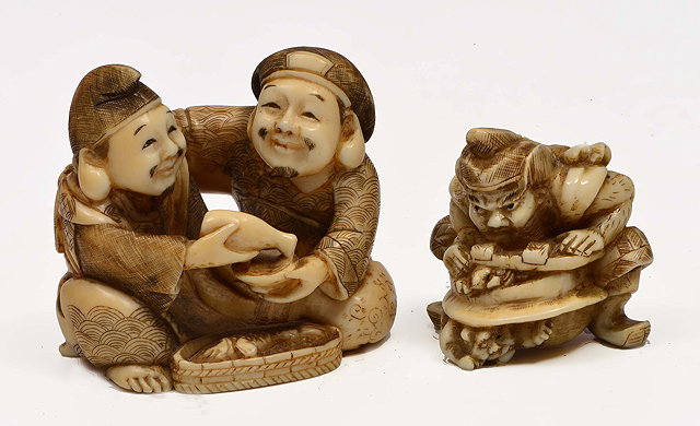 Appraisal: A JAPANESE IVORY OKIMONO in the form of two men