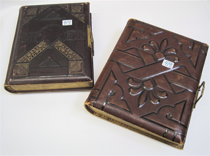 Appraisal: TWO EMBOSSED LEATHER PHOTO ALBUMS gilt edges and hinged metal