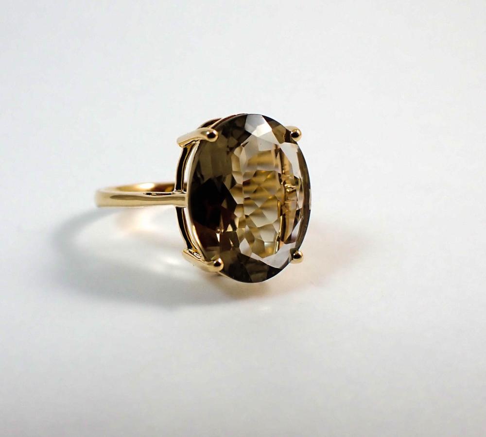 Appraisal: OLIVE GREEN QUARTZ AND FOURTEEN KARAT GOLD RING with four