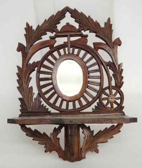 Appraisal: Wood wall shelf with mirror and high wheel motif