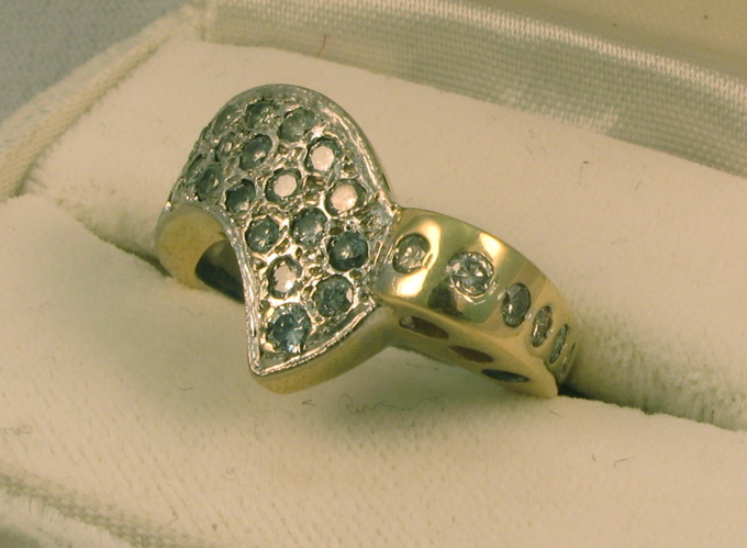 Appraisal: MAN'S DIAMOND AND FOURTEEN KARAT WHITE AND YELLOW GOLD RING