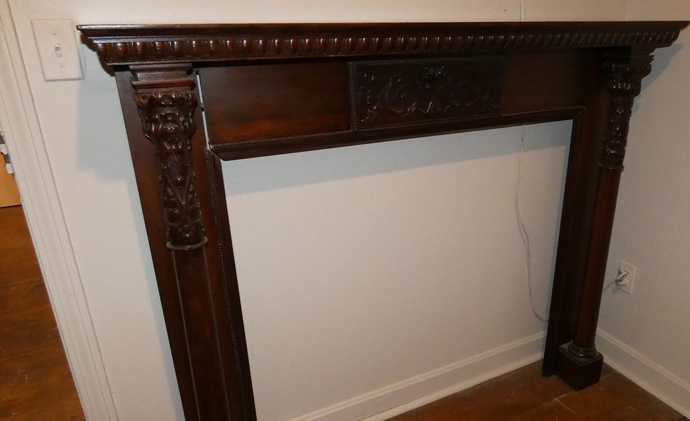 Appraisal: WALNUT FIREPLACE MANTLE SURROUND Victorian carved walnut fireplace surround and