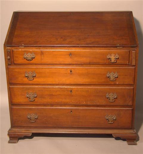 Appraisal: CHIPPENDALE STYLE MAHOGANY SLANT FRONT DESK the slant front enclosingcompartments