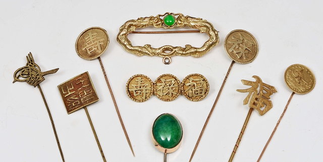 Appraisal: A CHINESE STICK PIN with jade cabochon a gold mounted