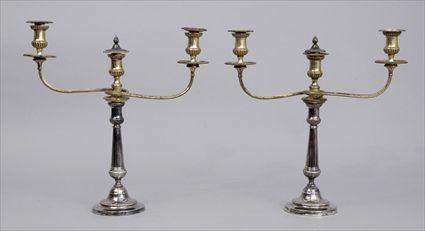 Appraisal: PAIR OF ENGLISH SILVER-PLATED THREE-LIGHT CANDELABRA Each flared stem with