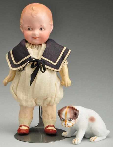 Appraisal: Heubach Character Doll with Puppy Description German bisque socket head