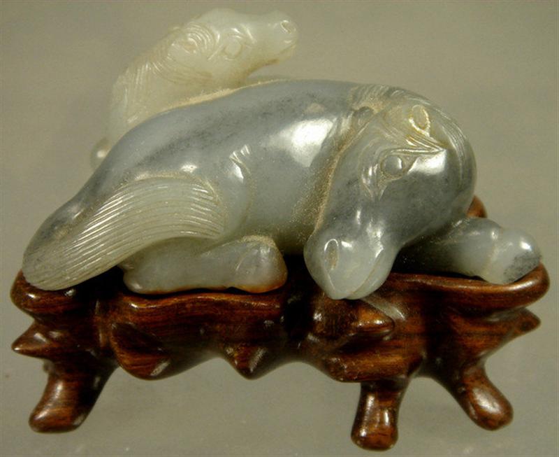 Appraisal: th c Chinese carved jade group with horses has carved