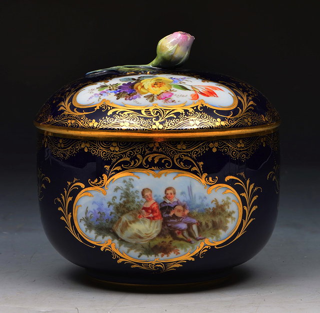 Appraisal: A MEISSEN COBALT BLUE GROUND SUCRIER AND COVER with painted