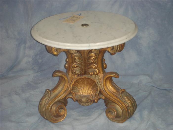 Appraisal: White marble top table on gilt composition base h Estimate